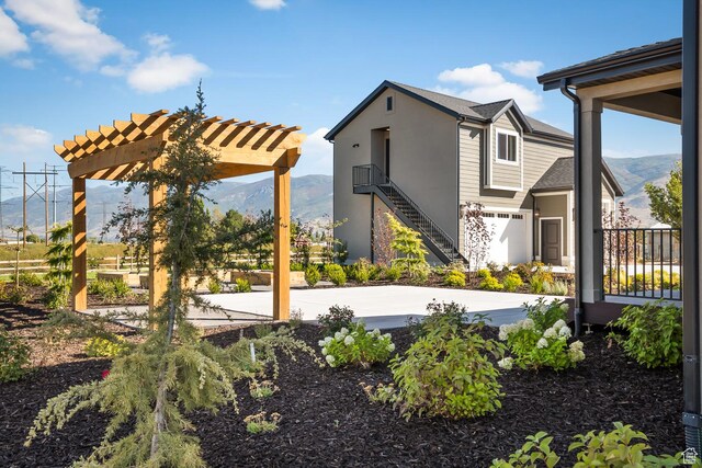 1478 W 400 N, West Bountiful, UT 84087 - exterior space with a mountain view, stucco siding, and a pergola