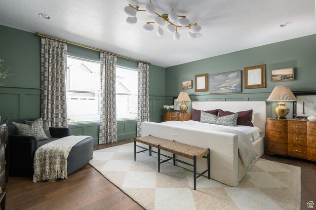 1478 W 400 N, West Bountiful, UT 84087 - bedroom featuring a ceiling fan, wainscoting, wood finished floors, and a decorative wall