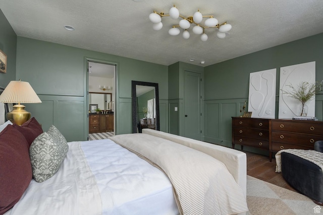 1478 W 400 N, West Bountiful, UT 84087 - bedroom featuring wood finished floors, a decorative wall, and a wainscoted wall