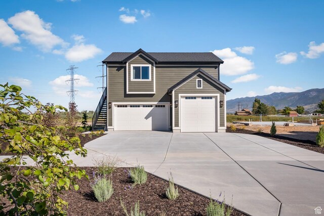1478 W 400 N, West Bountiful, UT 84087 - traditional-style house featuring a garage, a mountain view, driveway, and stairway