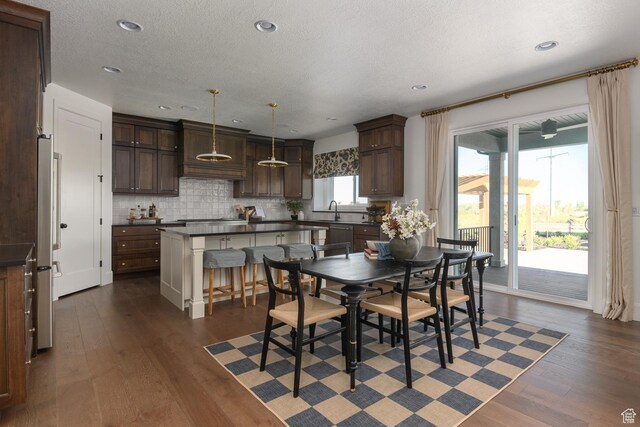 1478 W 400 N, West Bountiful, UT 84087 - dining room featuring recessed lighting, a textured ceiling, and dark wood-style floors