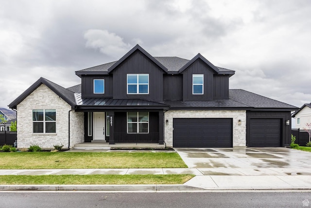 5081 W Sequoia Cir, Highland, UT 84003 - craftsman inspired home featuring a front lawn, board and batten siding, a standing seam roof, covered porch, and driveway