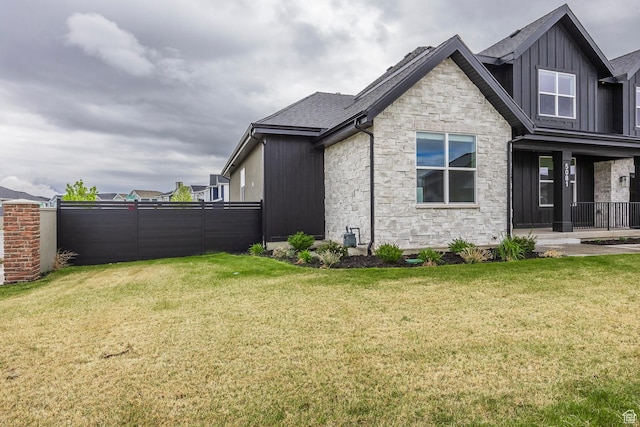 5081 W Sequoia Cir, Highland, UT 84003 - exterior space featuring a lawn, board and batten siding, and stone siding