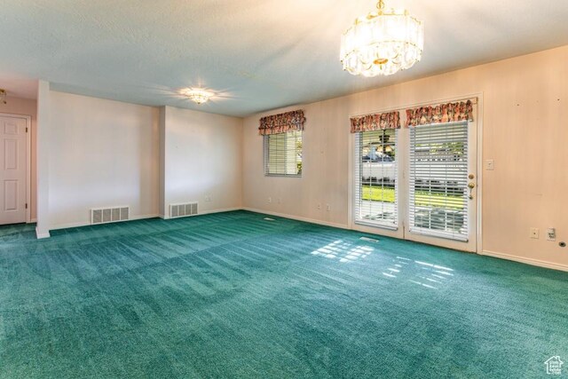 954 E 5650 S, South Ogden, UT 84405 - carpeted spare room with an inviting chandelier, a healthy amount of sunlight, and visible vents