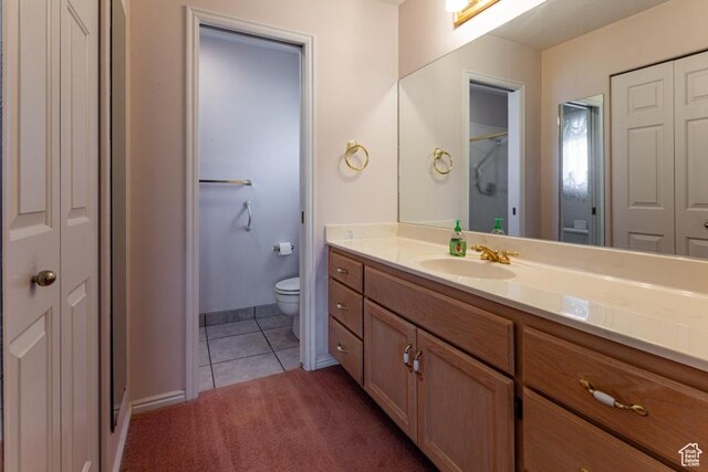 954 E 5650 S, South Ogden, UT 84405 - bathroom featuring vanity, toilet, tile patterned floors, baseboards, and a closet