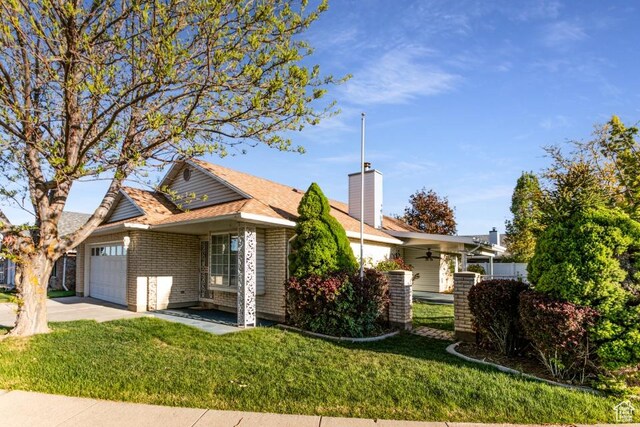 954 E 5650 S, South Ogden, UT 84405 - ranch-style home featuring a garage, ceiling fan, a front yard, central AC unit, and concrete driveway
