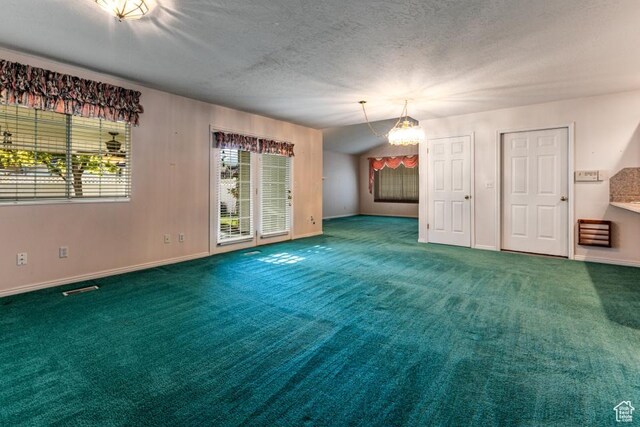 954 E 5650 S, South Ogden, UT 84405 - spare room featuring a textured ceiling, visible vents, baseboards, a notable chandelier, and carpet