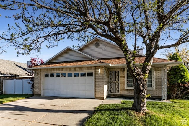 954 E 5650 S, South Ogden, UT 84405 - single story home featuring a garage, fence, driveway, and a front yard