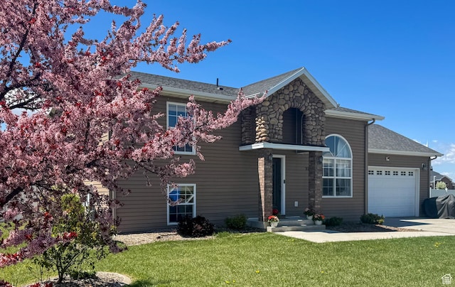 3261 S 1500 W, Nibley, UT 84321 - traditional home with a garage, a shingled roof, concrete driveway, and a front yard