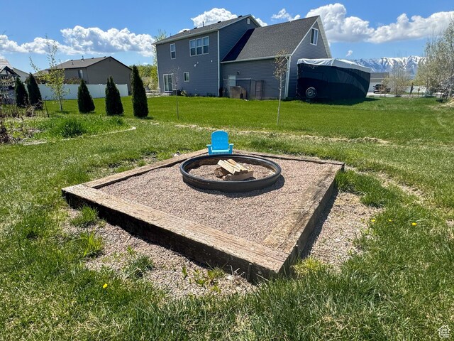 3261 S 1500 W, Nibley, UT 84321 - view of yard with an outdoor fire pit and fence
