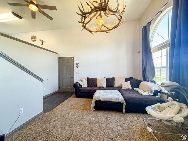 3261 S 1500 W, Nibley, UT 84321 - carpeted living room featuring baseboards and ceiling fan with notable chandelier