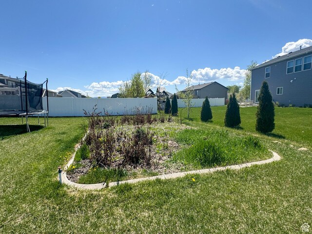 3261 S 1500 W, Nibley, UT 84321 - view of yard featuring fence and a trampoline