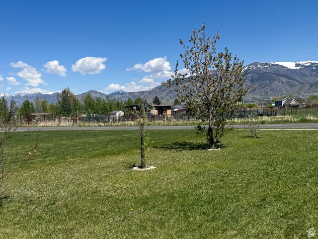 3261 S 1500 W, Nibley, UT 84321 - view of property's community with a lawn and a mountain view