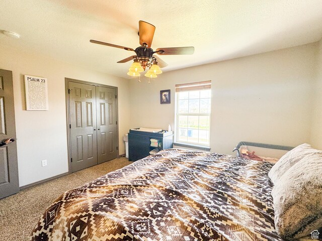 3261 S 1500 W, Nibley, UT 84321 - carpeted bedroom featuring baseboards, a ceiling fan, and a closet