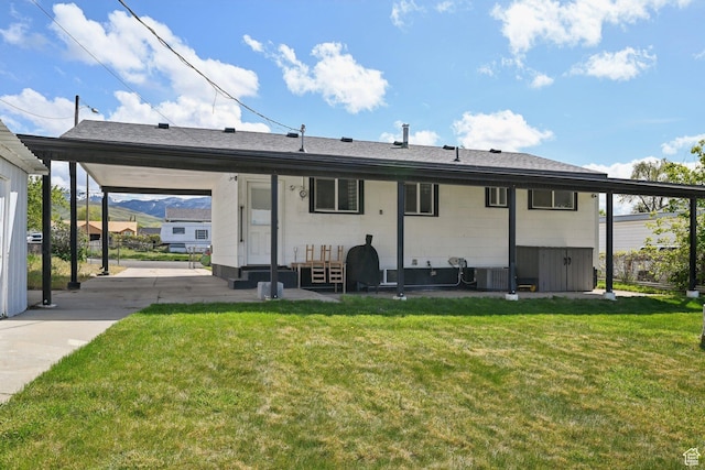 293 E Valley View Dr, Tooele, UT 84074 - back of house featuring entry steps, a yard, and central AC