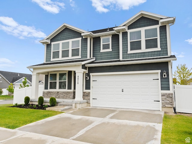 4928 W Eiffel Way, Riverton, UT 84096 - craftsman inspired home with stone siding, concrete driveway, a garage, and covered porch
