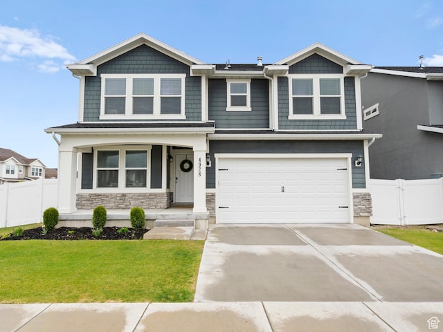 4928 W Eiffel Way, Riverton, UT 84096 - craftsman inspired home with covered porch, stone siding, an attached garage, and concrete driveway