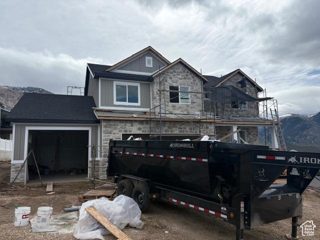 3636 N 500 E, North Ogden, UT 84414 - view of front of property featuring stone siding, board and batten siding, and a garage