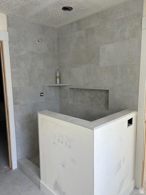 3636 N 500 E, North Ogden, UT 84414 - full bathroom featuring a textured ceiling and a tile shower