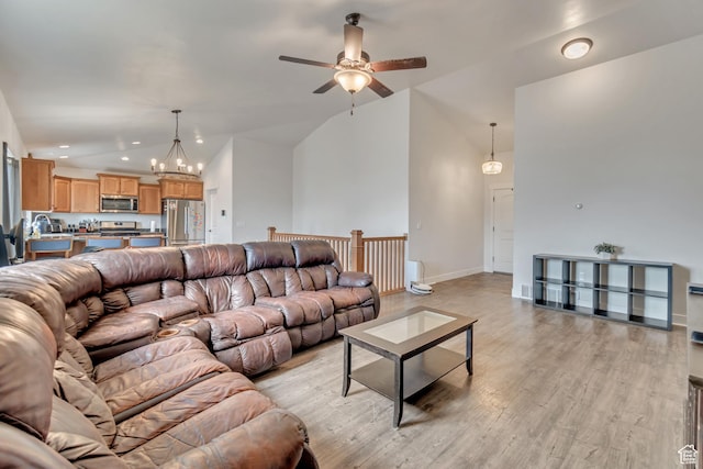 197 W Phelps St S, Grantsville, UT 84029 - living room featuring baseboards, high vaulted ceiling, ceiling fan with notable chandelier, light wood-style floors, and recessed lighting