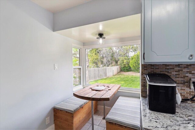 968 Bel Mar Dr, Ogden, UT 84403 - entryway with a wood stove and light tile patterned floors