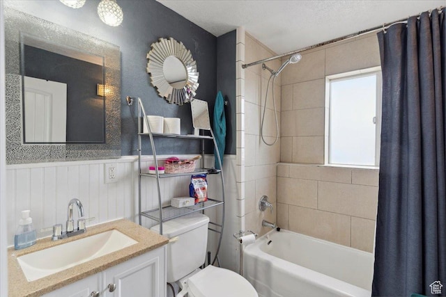 968 Bel Mar Dr, Ogden, UT 84403 - full bathroom featuring a wainscoted wall, vanity, toilet, and shower / tub combo with curtain