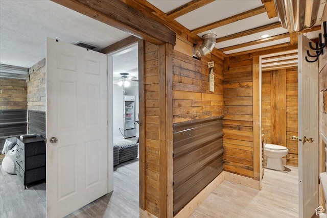 968 Bel Mar Dr, Ogden, UT 84403 - bathroom featuring wooden walls, ceiling fan, toilet, and wood finished floors