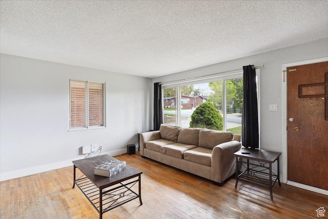 968 Bel Mar Dr, Ogden, UT 84403 - living area with a textured ceiling, baseboards, and wood finished floors