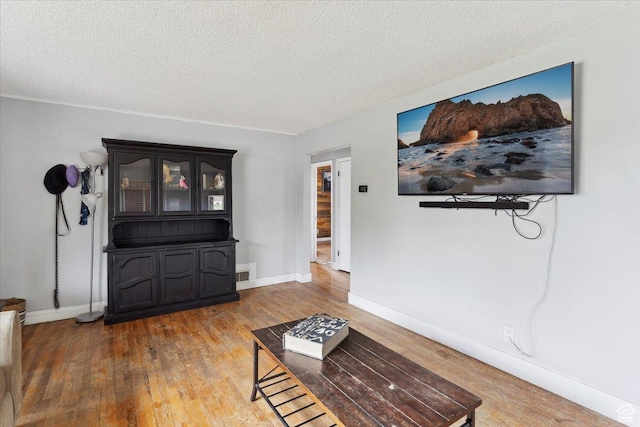 968 Bel Mar Dr, Ogden, UT 84403 - living area with baseboards, a textured ceiling, visible vents, and wood finished floors