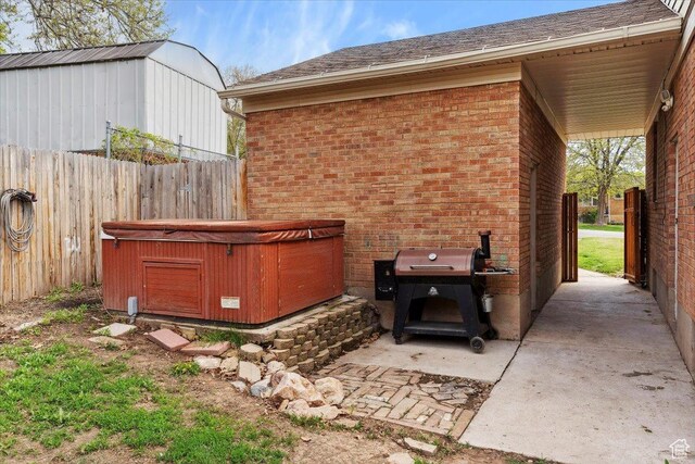 968 Bel Mar Dr, Ogden, UT 84403 - view of patio / terrace featuring a hot tub and fence