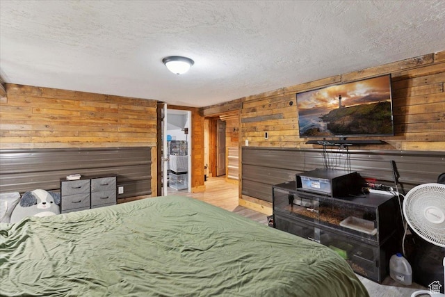968 Bel Mar Dr, Ogden, UT 84403 - bedroom featuring a textured ceiling, wood walls, and wood finished floors