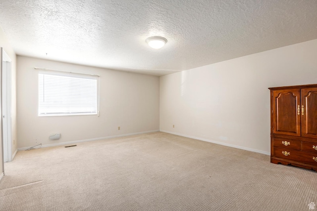 176 N 170 E, Orem, UT 84057 - empty room with baseboards, visible vents, a textured ceiling, and light colored carpet