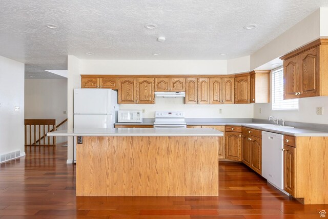 176 N 170 E, Orem, UT 84057 - kitchen with a sink, white appliances, under cabinet range hood, visible vents, and a kitchen island