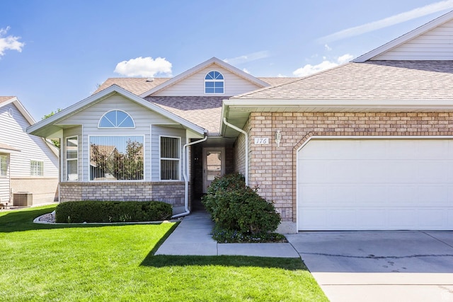 176 N 170 E, Orem, UT 84057 - view of front of property featuring roof with shingles, a front lawn, brick siding, a garage, and concrete driveway