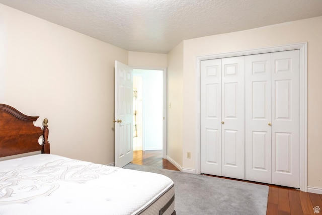 176 N 170 E, Orem, UT 84057 - bedroom featuring a textured ceiling, baseboards, a closet, and wood finished floors