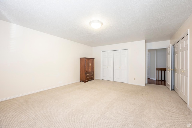 176 N 170 E, Orem, UT 84057 - unfurnished bedroom with baseboards, light carpet, and a textured ceiling