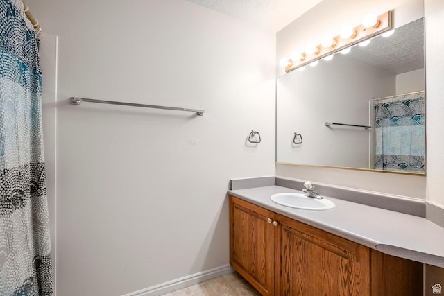 176 N 170 E, Orem, UT 84057 - bathroom featuring baseboards, curtained shower, and vanity