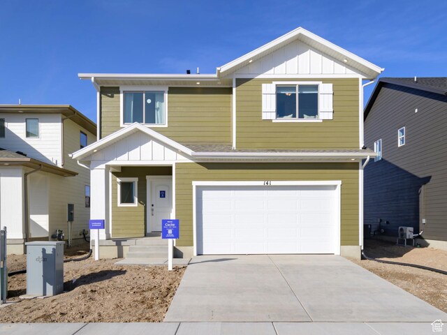 141 N Gallery St, Saratoga Springs, UT 84045 - view of front of property with board and batten siding, an attached garage, and driveway