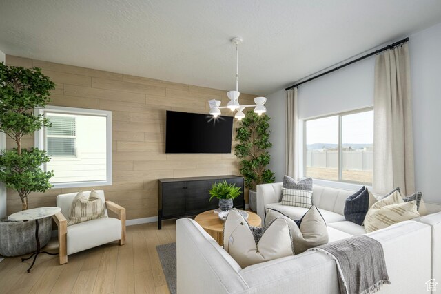 141 N Gallery St, Saratoga Springs, UT 84045 - living room with wooden walls, baseboards, and wood finished floors