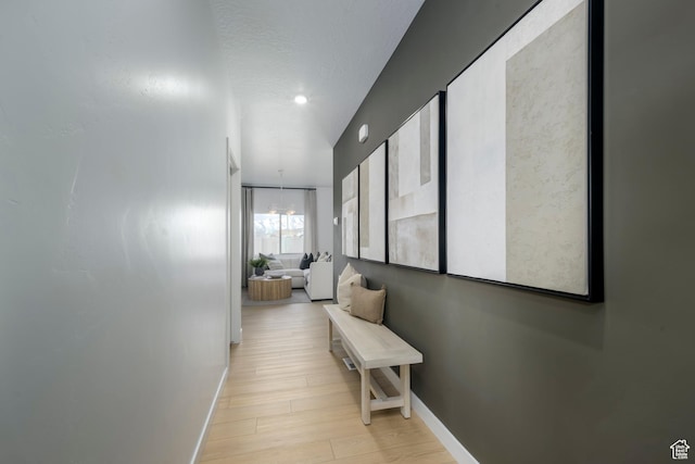 141 N Gallery St, Saratoga Springs, UT 84045 - corridor with baseboards and light wood-style flooring