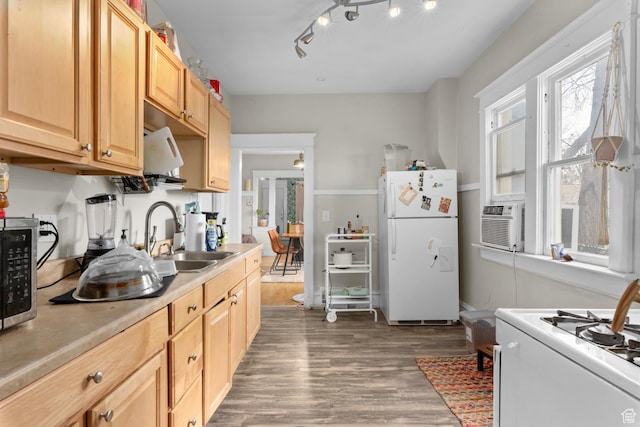 1470 S Edison St, Salt Lake City, UT 84115 - kitchen featuring light brown cabinetry, wood finished floors, a sink, light countertops, and white appliances