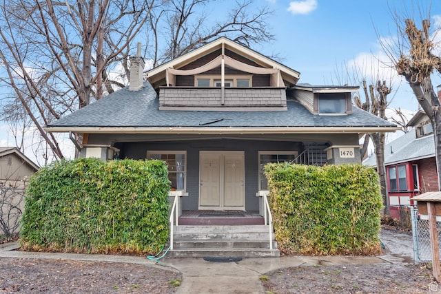 1470 S Edison St, Salt Lake City, UT 84115 - bungalow-style house featuring roof with shingles, a chimney, a porch, and a balcony