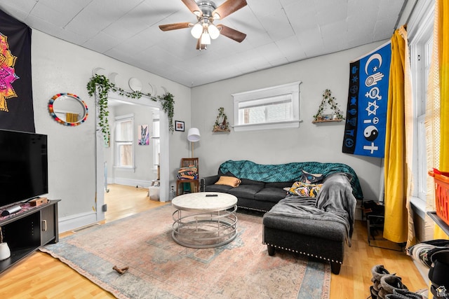 1470 S Edison St, Salt Lake City, UT 84115 - living room featuring a healthy amount of sunlight, a ceiling fan, wood finished floors, and visible vents