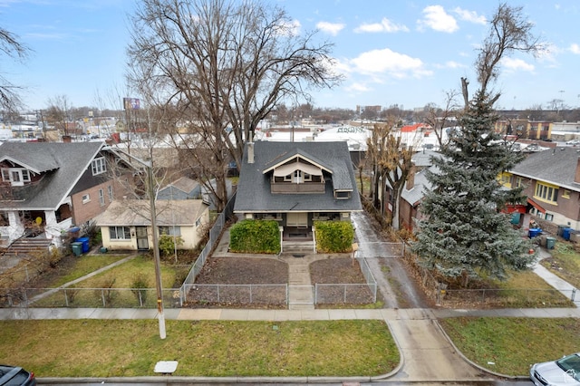 1470 S Edison St, Salt Lake City, UT 84115 - view of front of house featuring a porch, a fenced front yard, a front yard, and a residential view
