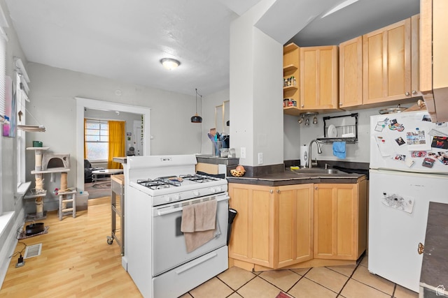 1470 S Edison St, Salt Lake City, UT 84115 - kitchen featuring dark countertops, open shelves, a sink, light brown cabinets, and white appliances