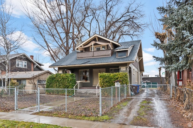 1470 S Edison St, Salt Lake City, UT 84115 - bungalow-style home with a shingled roof, a fenced front yard, a porch, a gate, and driveway