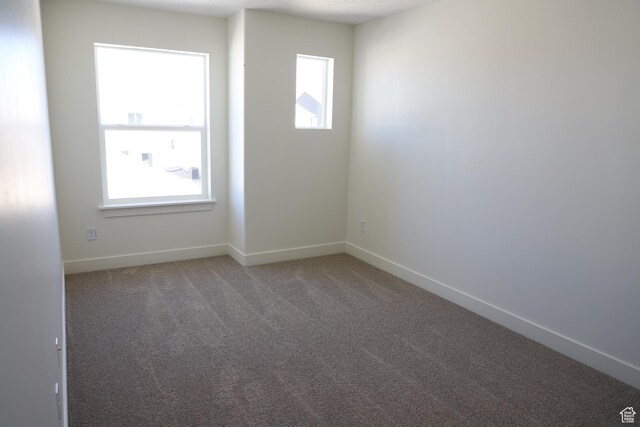 3743 N Janie St Unit 1010, Eagle Mountain, UT 84005 - spare room featuring light colored carpet, baseboards, and a wealth of natural light