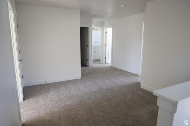 3743 N Janie St Unit 1010, Eagle Mountain, UT 84005 - unfurnished room with baseboards, visible vents, and carpet