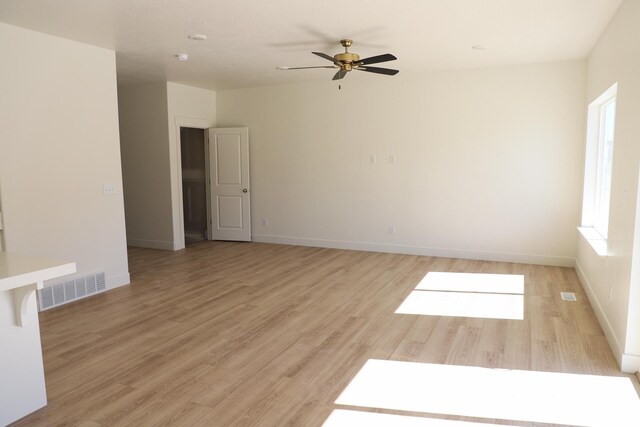 3743 N Janie St Unit 1010, Eagle Mountain, UT 84005 - empty room featuring ceiling fan, visible vents, baseboards, and light wood-style floors