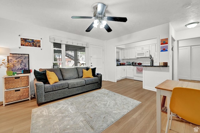 130 S 1300 E Unit 209, Salt Lake City, UT 84102 - living room with a ceiling fan and light wood-style flooring